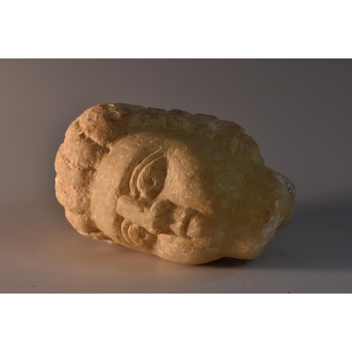 3497 - Antiquities - a crystalline marble fragment, of a head, carved in the Hellenic manner, 7.5cm high