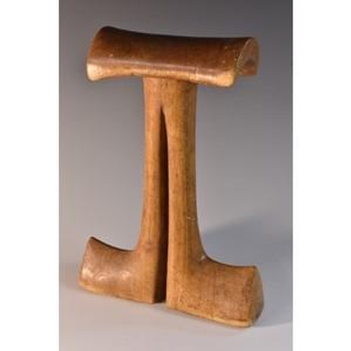 3506 - Tribal Art - a Karamojong head rest, arched cresting, the divided support terminating in broad feet,... 