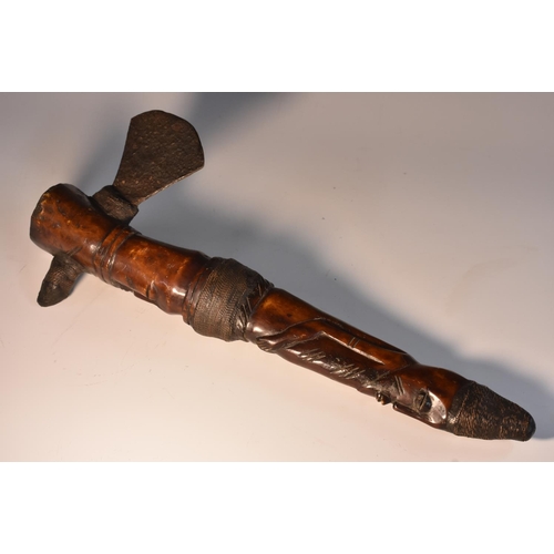 3513 - Tribal Art - an African axe, probably Yoruba, the bone shaft carved as a stylised figure, fan-shaped... 