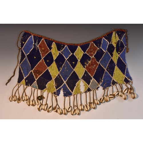 3514 - Tribal Art - an African beadwork garment/adornment, cowrie shell fringe, 49cm wide