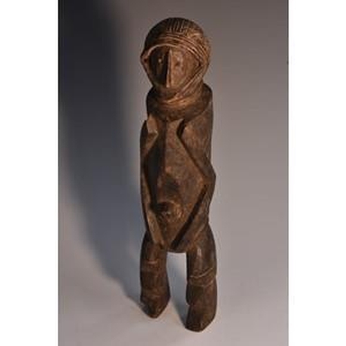 3517 - Tribal Art - an African doll, carved as a stylized figure, 24cm long