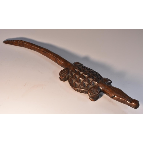 3519 - Tribal Art - an African hardwood headrest, carved as a crocodile, naive teeth, scales, traverse rows... 