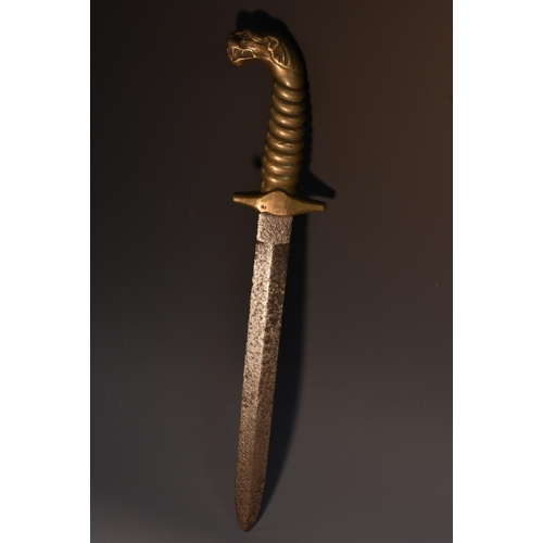 3548 - An early 19th century dagger, 24cm double-edged blade, the cast brass haft with ribbed grip terminat... 