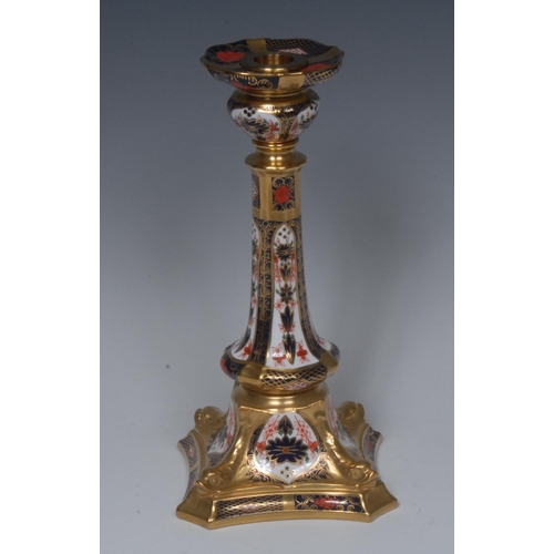 110 - A Royal Crown Derby 1128 pattern Castleton candlestick, dolphin to angles, incurved square base, pri... 