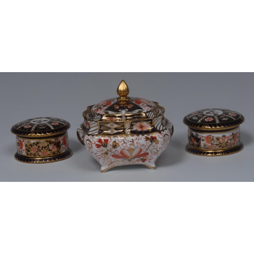 144 - A Royal Crown Derby 6299 pattern circular box and cover, gadrooned rim, 5.5cm diam, printed mark, da... 