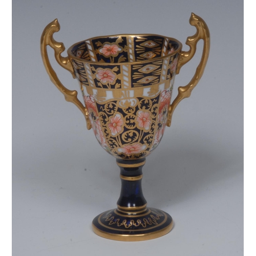 146 - A Royal Crown Derby 6299 pattern miniature/toy two handled pedestal trophy vase, 10.5cm high, printe... 