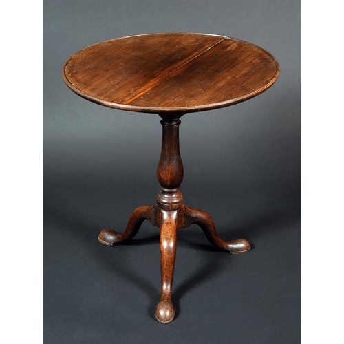 1568 - A George III mahogany tripod supper table, circular tilting top, bird cage support, slender baluster... 