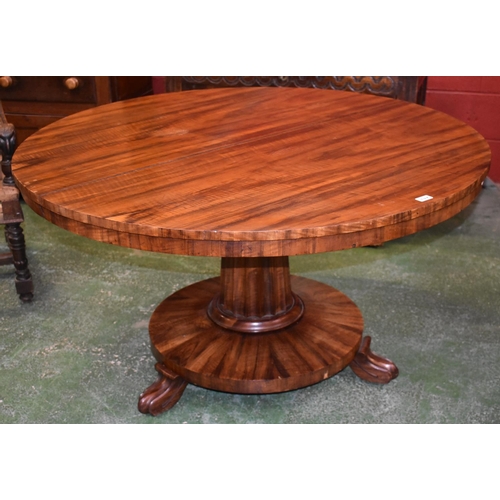 1570A - A George III/William IV mahogany circular centre table, well figured top above a deep frieze, fluted... 