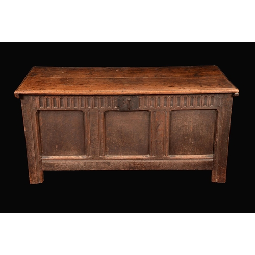 1578 - A Charles II oak blanket chest, slightly oversailing hinged top above a nulled frieze above three ch... 