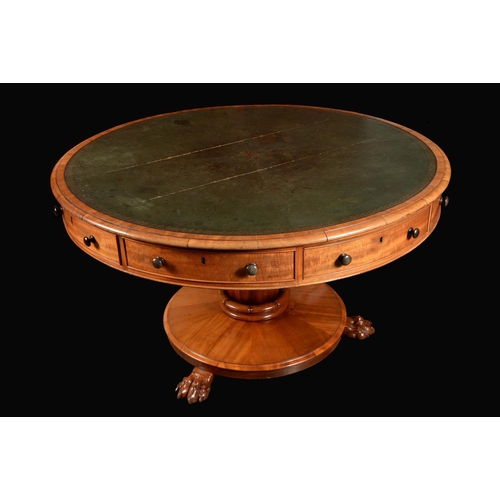 1589 - A George IV mahogany library drum table, inset tooled and gilt leather writing surface above four co... 