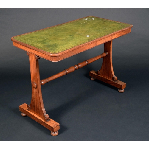 1591 - A George IV mahogany rounded rectangular writing table, slightly oversailing top with inset tooled a... 