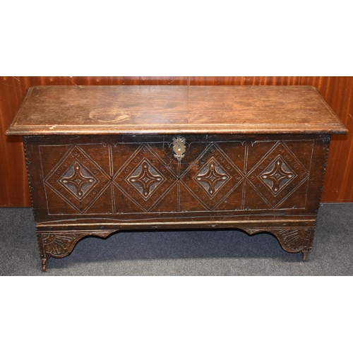 1599 - A late 17th century oak six-plank chest, hinged moulded top, the front carved with four lozenges, sh... 