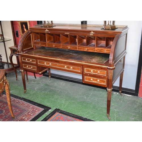 1607A - A Directoire design gilt metal and brass mounted cylinder desk, pierced three-quarter gallery above ... 