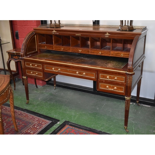 1607A - A Directoire design gilt metal and brass mounted cylinder desk, pierced three-quarter gallery above ... 