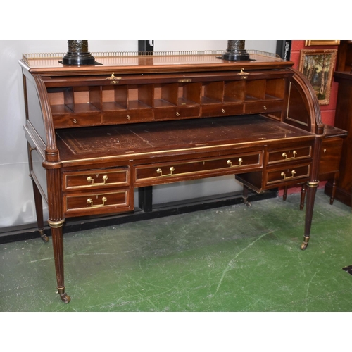 1607A - A Directoire design gilt metal and brass mounted cylinder desk, pierced three-quarter gallery above ... 