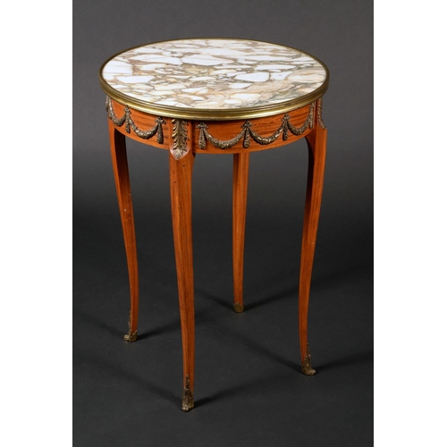 1608 - A Louis XVI style gilt metal mounted satinwood centre table, circular marble top above a deep frieze... 