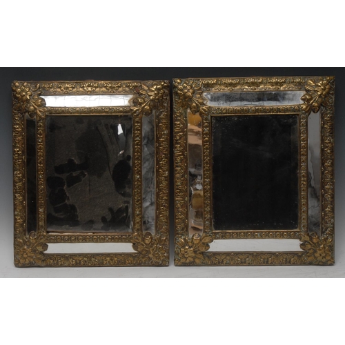 1612 - A pair of 19th century Continental gilt-brass mounted rectangular looking-glasses, central bevelled ... 