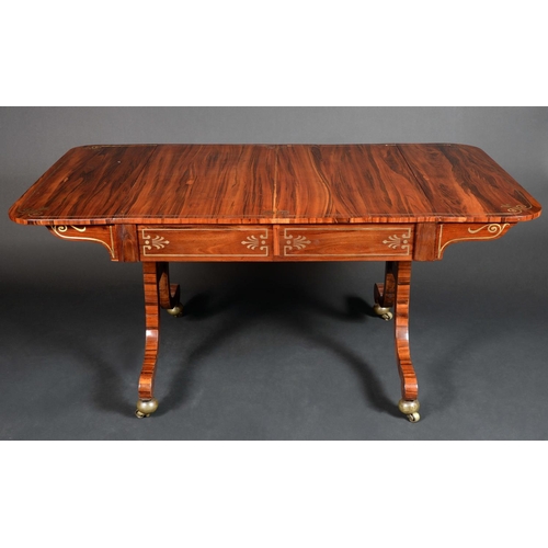 1630 - A Regency rosewood and brass marquetry rounded rectangular sofa table, slightly oversailing top abov... 