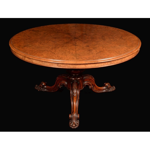 1640 - A Victorian burr walnut breakfast table, with well figured radiating veneers, ovolu moulded rim, bol... 