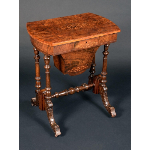 1644 - A Victorian walnut bowed rectangular work table, hinged quarter veneered top enclosing an arrangemen... 