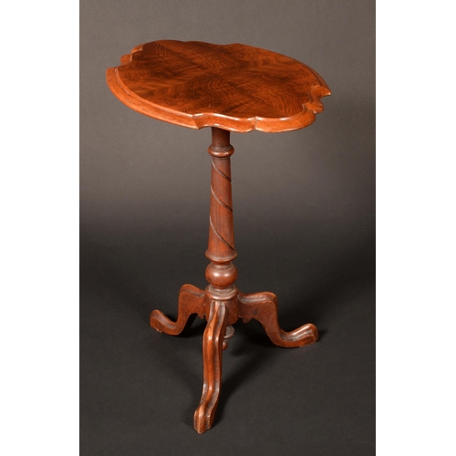 1651 - A Victorian mahogany tripod occasional table, quarter-veneered shaped oval top, spirally turned colu... 