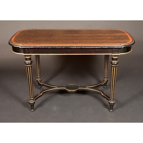 1653 - A Victorian maple crossbanded coromandel and ebonised library centre table, in the manner of Howard ... 