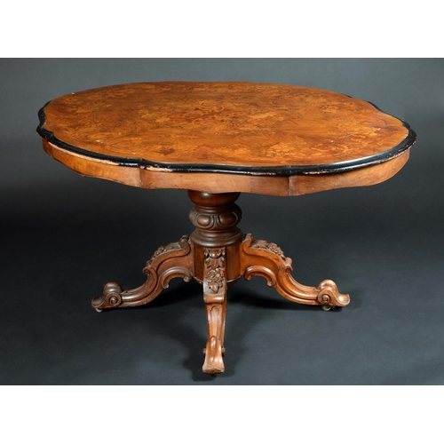 1656 - A Victorian walnut and marquetry shaped oval centre table, the quarter-veneered top well inlaid with... 