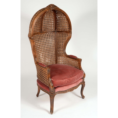 1663 - A Franglais walnut porter's chair, wickerworked hooded back, padded arms, squab cushion, carved cabr... 