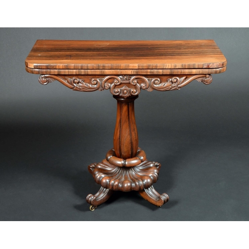 1667 - A William IV rosewood pedestal card table, rounded rectangular moulded top enclosing a baize-lined p... 