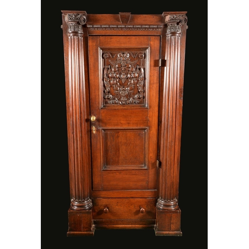 1672 - An '18th century' oak hall cupboard, rectangular panelled door carved in the Baroque taste with a ca... 