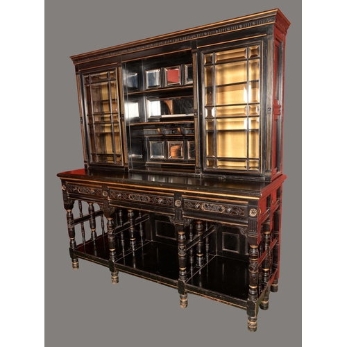 1674 - An Aesthetic Movement ebonised and parcel-gilt side cabinet, shallow moulded cornice above a mirrore... 