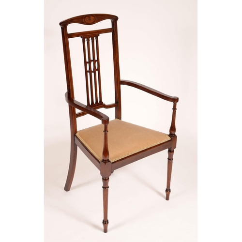 1677 - An Edwardian mahogany open arm chair, shaped top rail, pierced splat, padded seat, turned legs, outl... 