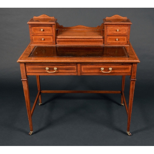 1690 - An Edwardian mahogany writing desk, stamped A & H Barlow & Co Wigan, hinged cover opening to station... 