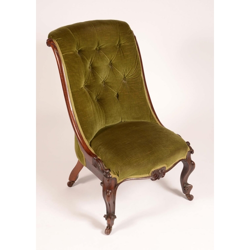 1702 - An early Victorian mahogany nursing chair, deep stuffed-over upholstery, carved with scrolling lotus... 