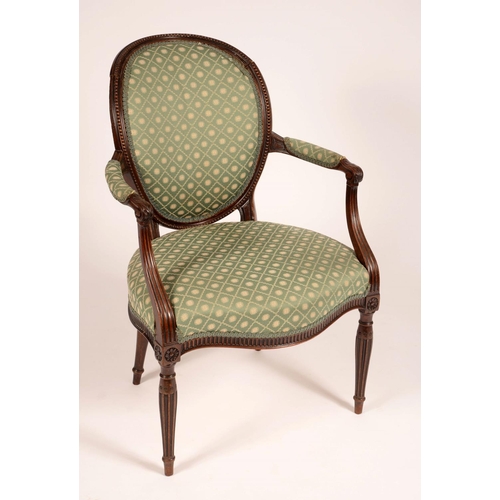 1705 - A George III French Hepplewhite mahogany elbow chair, oval back with beaded border, outswept arms ca... 