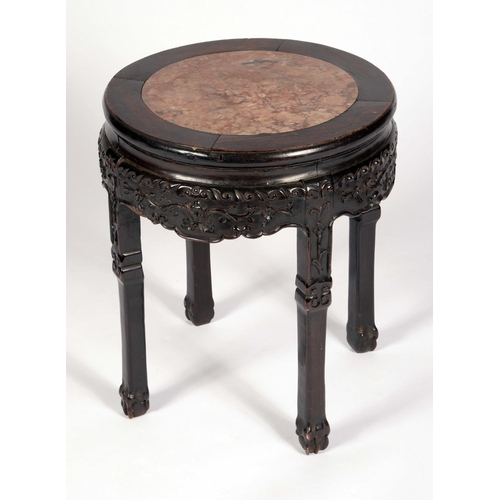 1716 - A Chinese padouk wood circular jardiniere stand, the top set with soapstone roundel, above a shaped ... 