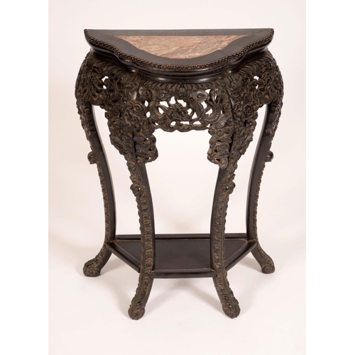 1720 - A Chinese hardwood shaped demi-lune jardiniere stand, inset soapstone top, beaded border, above a de... 