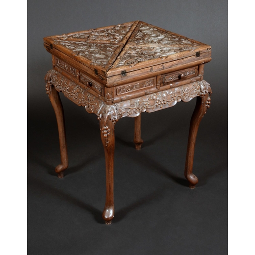 1725 - A 19th century Chinese hardwood envelope card table, folding top enclosing counter wells, above four... 