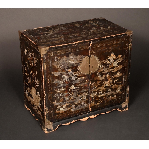 1731 - A 19th century Chinese lacquer and abalone marquetry table-top cabinet, decorated and inlaid with fi... 