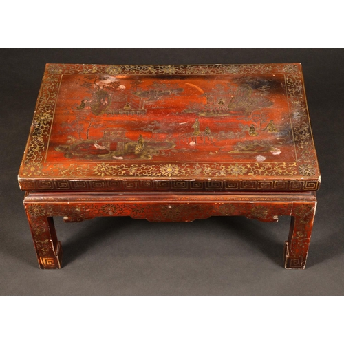 1734 - A Chinese lacquer low tea table, decorated in gilt  with monumental landscape, shaped apron, scroll ... 