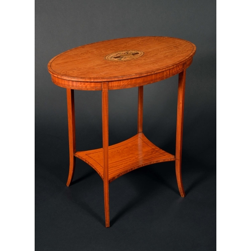 1740 - An Edwardian satinwood and marquetry oval occasional table, crossbanded top inlaid with a musical tr... 