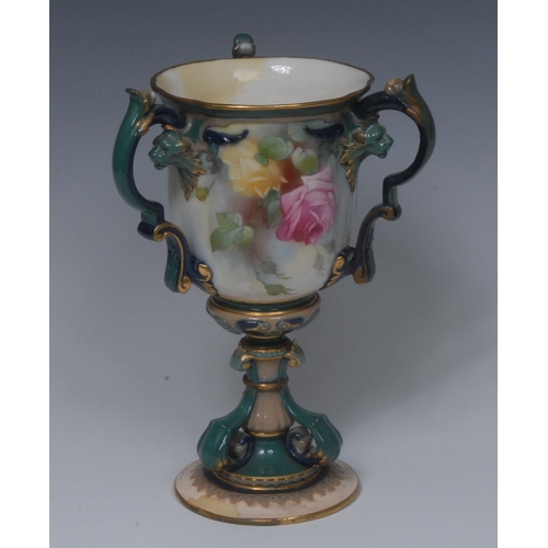 192 - A Royal Worcester Hadley three handled pedestal vase, decorated with yellow and red roses, lion mask... 