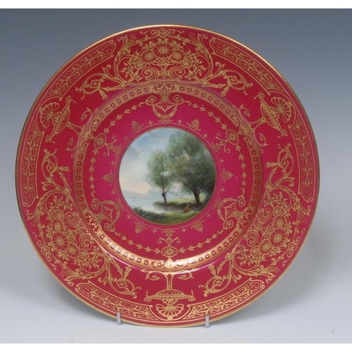 193 - A Royal Worcester circular plate,  painted by G. H. Evans, in the manner of Corot, with figure seate... 