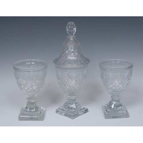 212 - A harlequin Regency cut glass sweetmeat garniture, possibly Irish, comprising a central urnular jar ... 