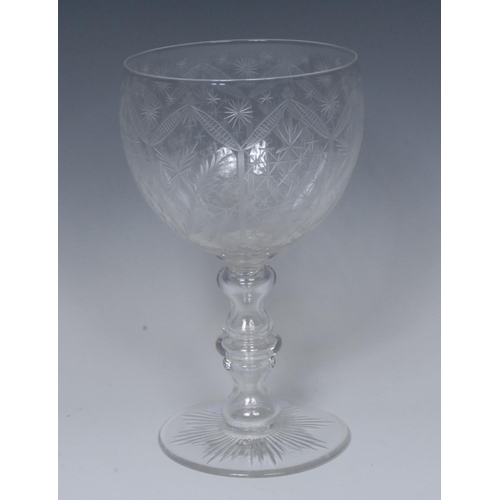 218 - A Victorian cut glass goblet, the rounded bucket shaped bowl engraved with alternating stars and lea... 