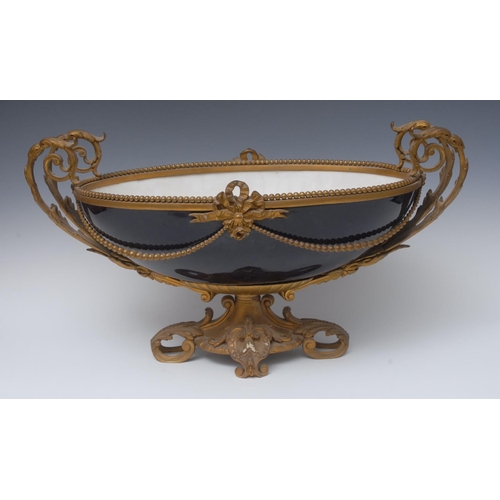 230 - A large French ormolu mounted two-handled boat shaped centrepiece, possibly Sevres, in Bleu Royale, ... 