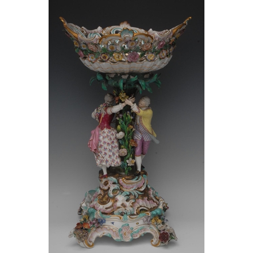 231 - A large Meissen centrepiece, pieced and encrusted oval bowl, the column surmounted with two figures ... 