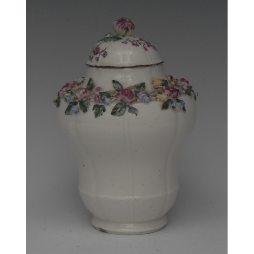 237 - A Mennecy lobed ogee shaped vase and cover,  encrusted with band of flowers to shoulders, domed cove... 