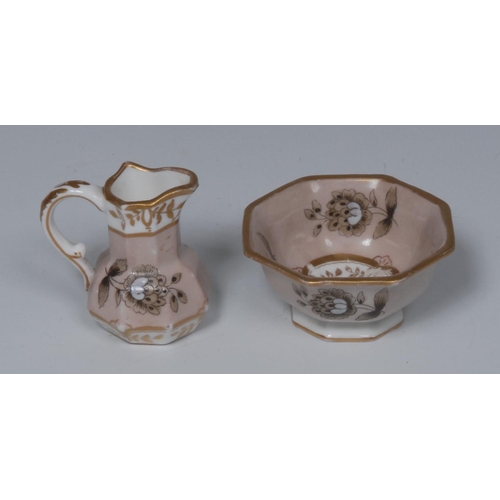 61 - A Spode miniature Hydra jug and basin, painted with black and white flowers stems on a beige backgro... 