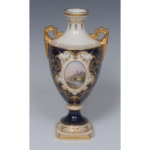 67 - A Coalport two-handed pedestal ovoid vase, painted with a landscape within a gilded oval cartouche, ... 